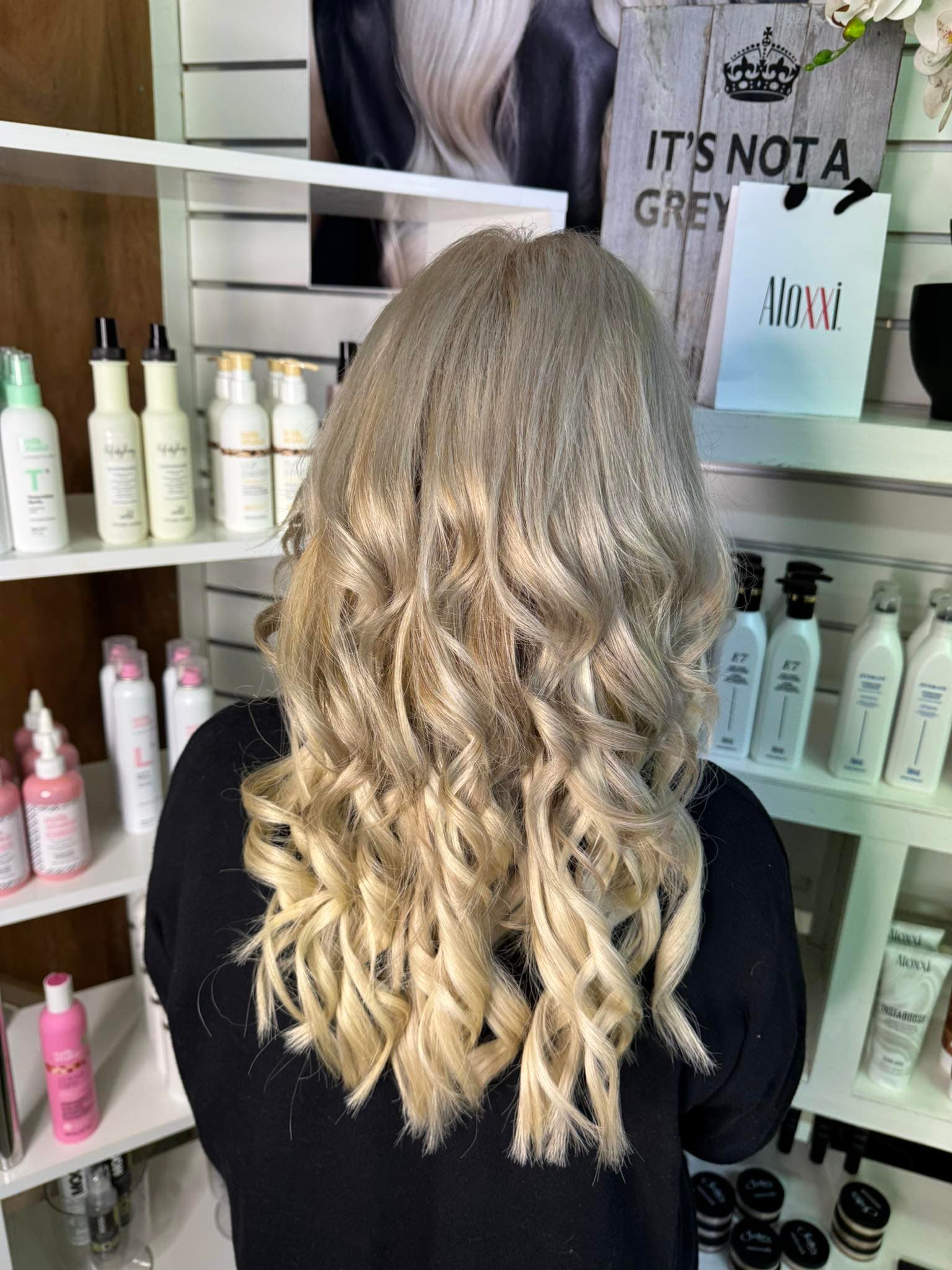 Soft blonde curls styled at My Place Hair & Beauty